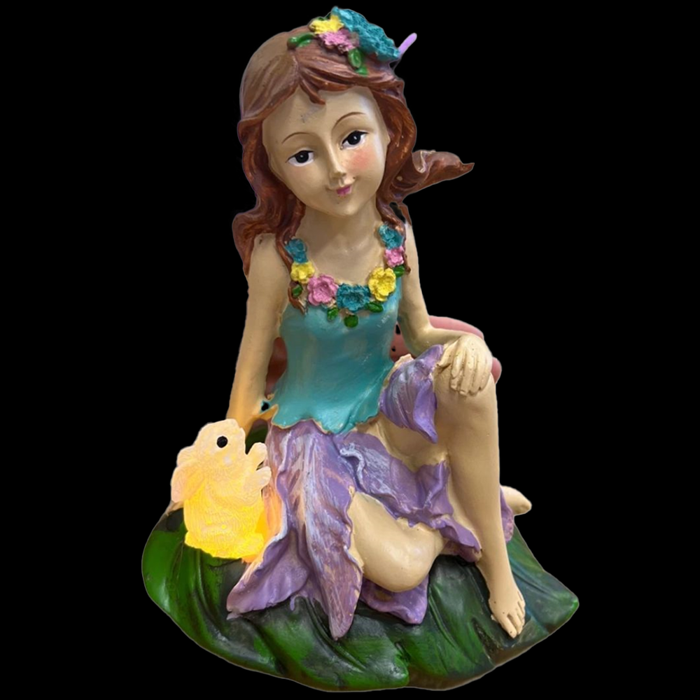 a beautiful fairy garden fairy with a bunny rabbit that lights up