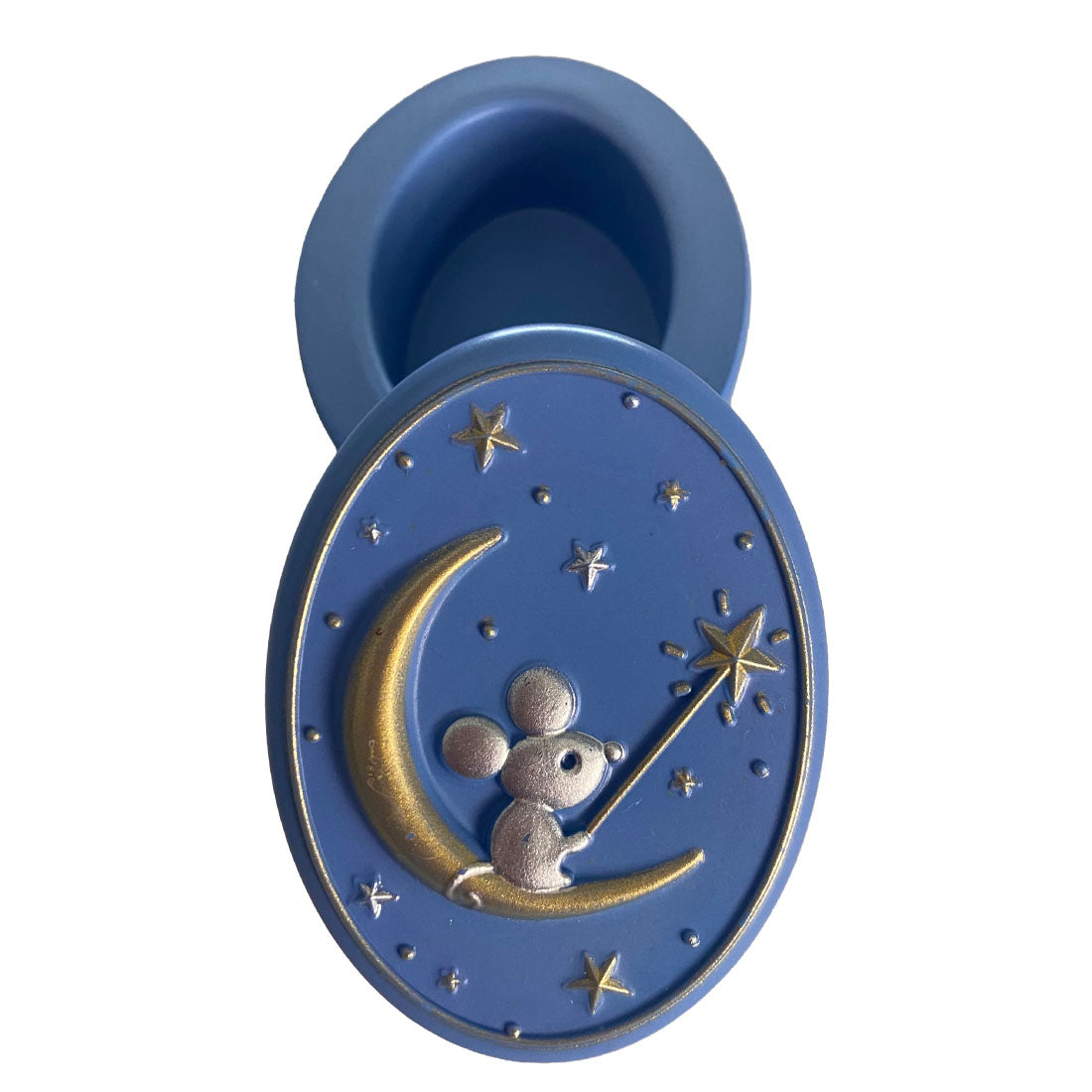 Blue silicone mold with a mouse and moon design on a white background