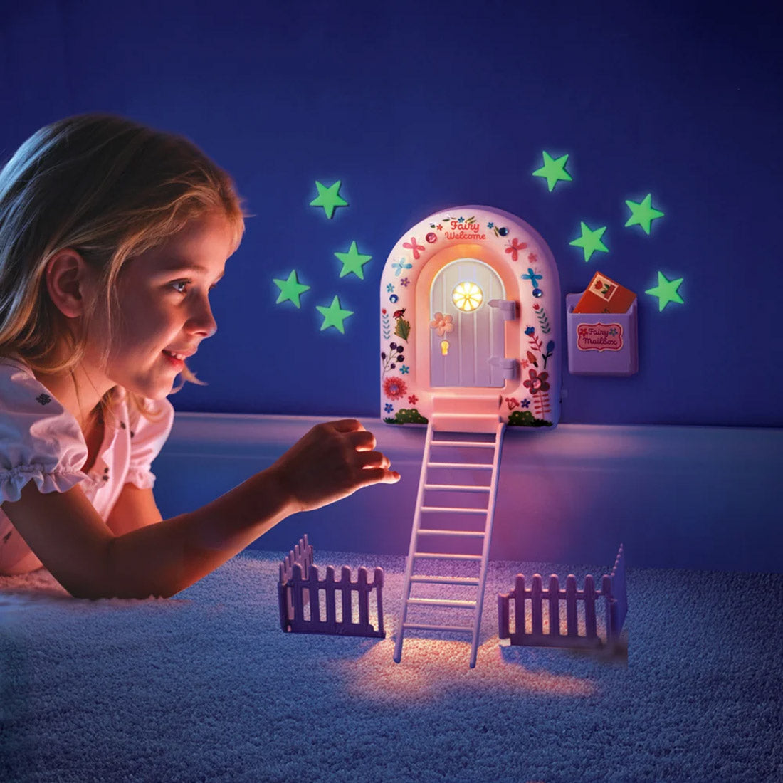 Child looking at a glowing fairy door with stars on a dark blue wall.