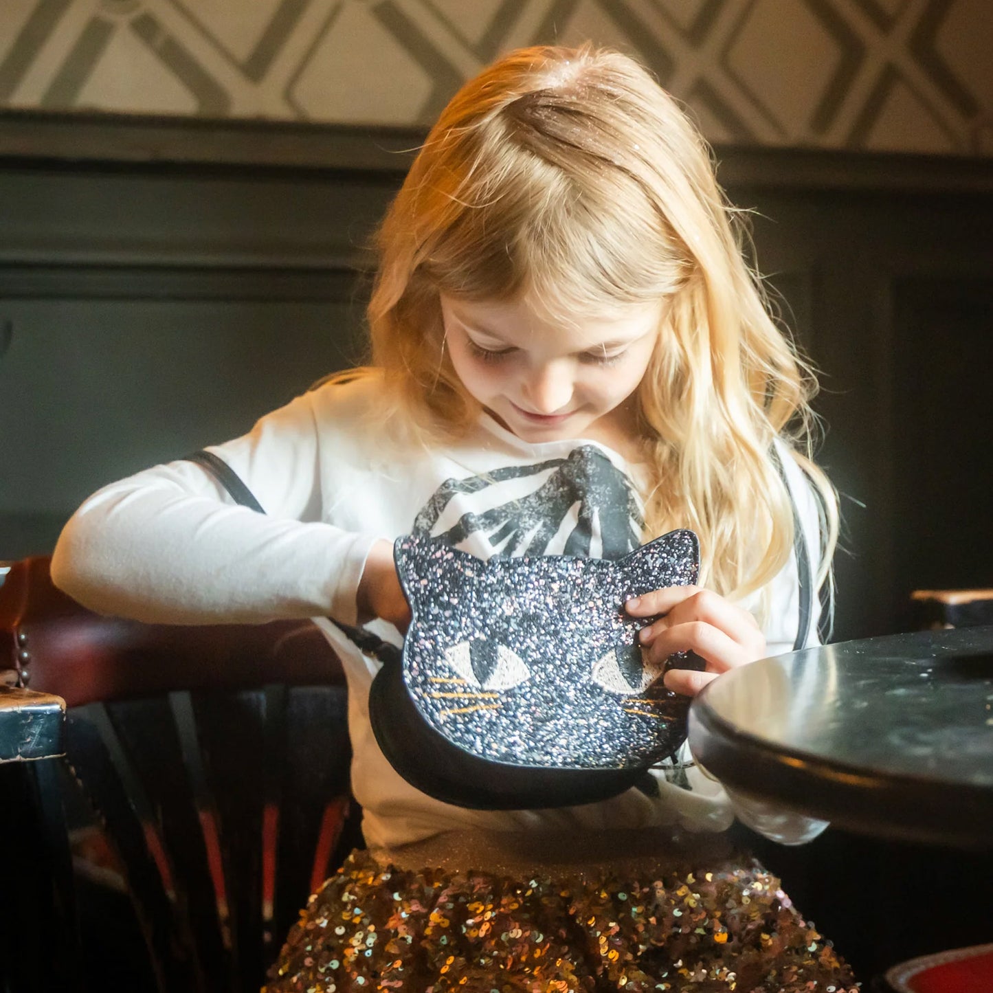 a black cat face glittery girls bag