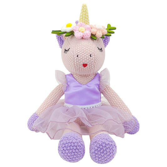 unicorn soft toy in a removable purple dress