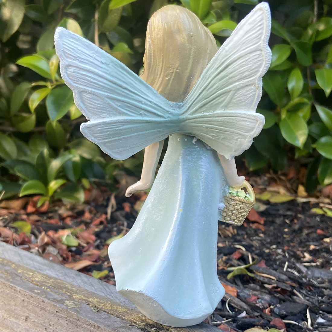 Fairy Figurine Holding Basket of Flowers