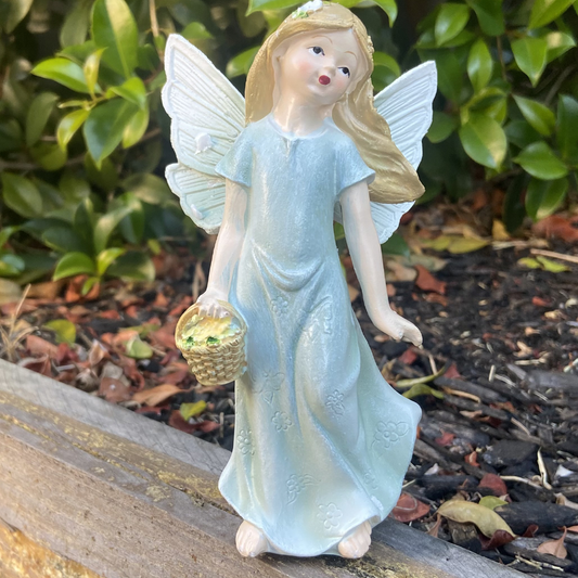 Fairy Figurine Holding Basket of Flowers