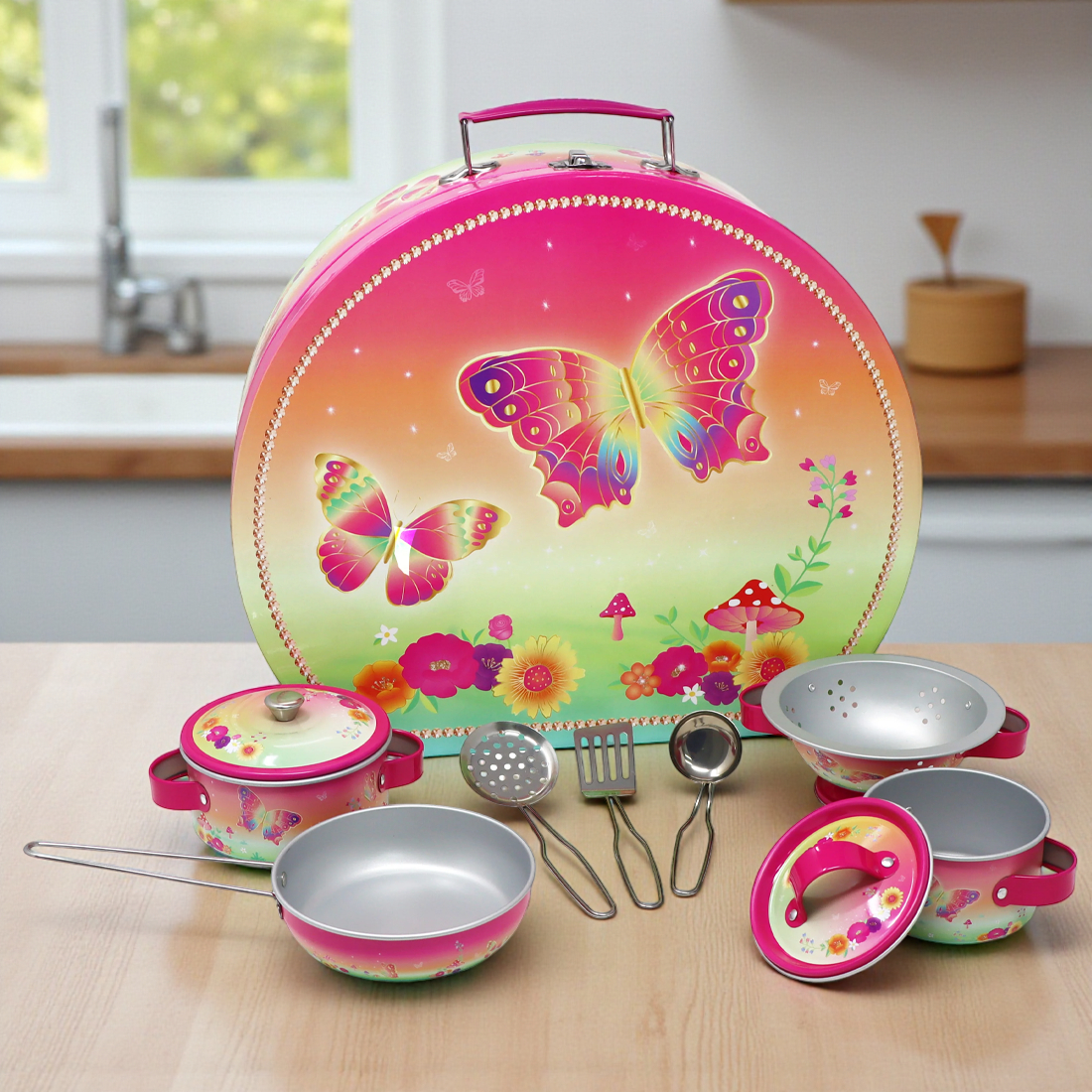 Children's kitchen set with colorful butterfly design on a wooden surface