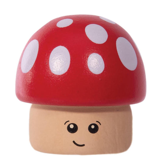 A small mushroom-shaped toy with a glossy red cap, white polka dots, and a light beige wooden base featuring a simple black face, shown on a plain white background.