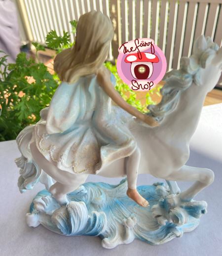 Girl on Ice Horse Riding Waves Figurine